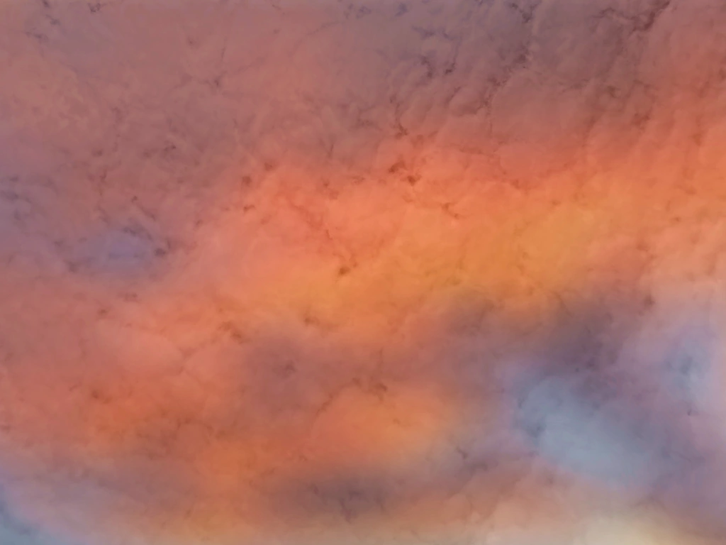 double exposure of orange smoky clouds