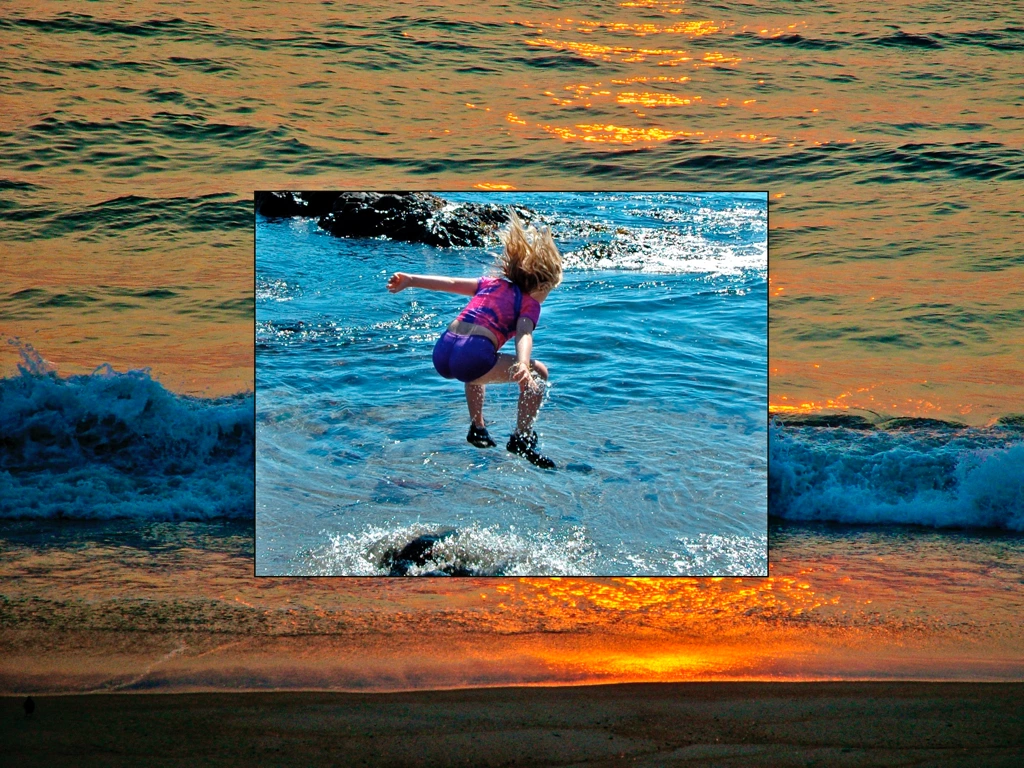 small child jumping over waves in ocean